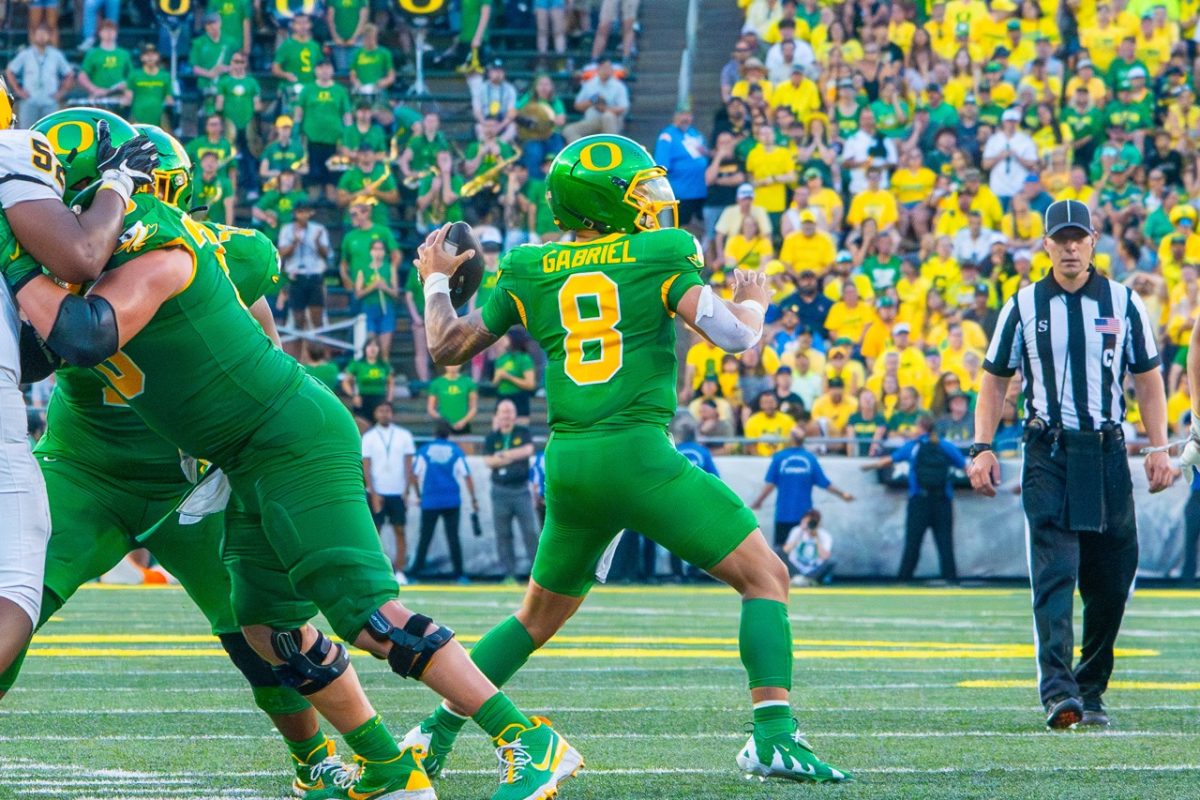 Dillon Gabriel(8) looking to pass. The University of Oregon Ducks Football team played the University of Idaho in a home match at Autzen Stadium in Eugene, Ore., on August 31st, 2024. (Spencer So/Emerald)