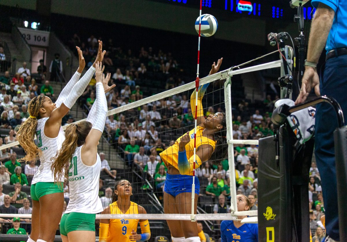 Onye Ofoegbu (13) and Roberta Purashaj (21) attempt to block Torrey Stafford (4). The University of Oregon Ducks lost 3 sets to 0 against the University of Pittsburgh Panthers Friday. 