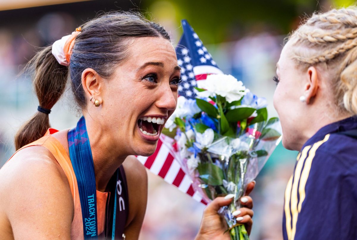 Courtney Wayment celebrates with some of her friends and teammates after punching her ticket to Paris. The most elite athletes in the country meet at Hayward Field for the 2024 Summer Olympic Trials in Eugene, Ore. on June 22, 2024. (Jonathan Suni/Emerald)