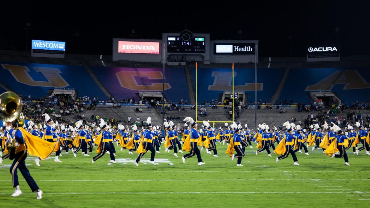 The UCLA Bruin Marching Band hits the field as fans begin to fill the stands as kickoff nears. The Oregon Ducks take on the UCLA Bruins in its first Big Ten Conference game in the Rose Bowl in Pasadena, CA on Sept. 28, 2024. (Jonathan Suni/Emerald)