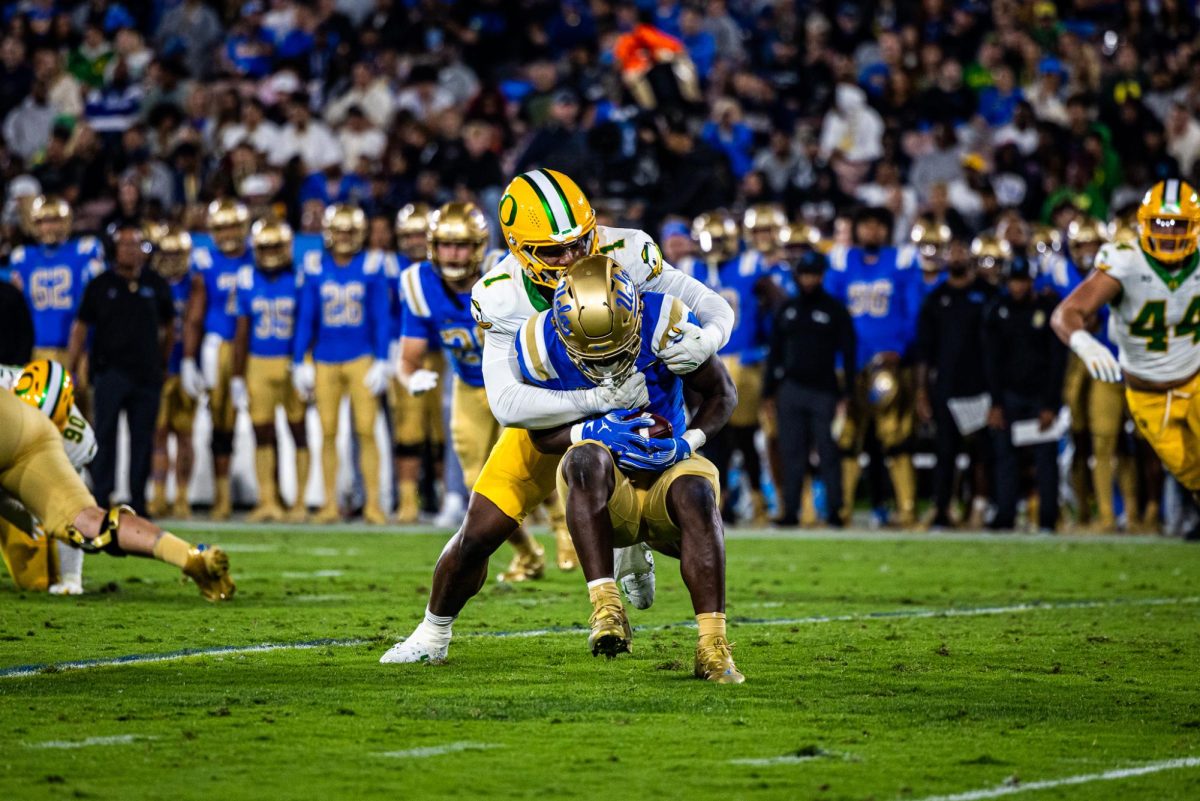 Jordan Burch (1) goes through the offensive line untouched and swallows up the UCLA ball carrier. The Oregon Ducks take on the UCLA Bruins in its first Big Ten Conference game in the Rose Bowl in Pasadena, CA on Sept. 28, 2024. (Jonathan Suni/Emerald)