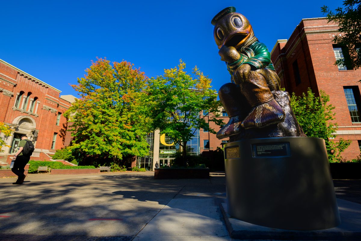 A statue of the Duck striking the famous "The Thinker" pose resides outside of the Lillis Business Complex at the University of Oregon in Eugene, Ore., on Oct. 1, 2024.  (Eric Becker/Emerald)