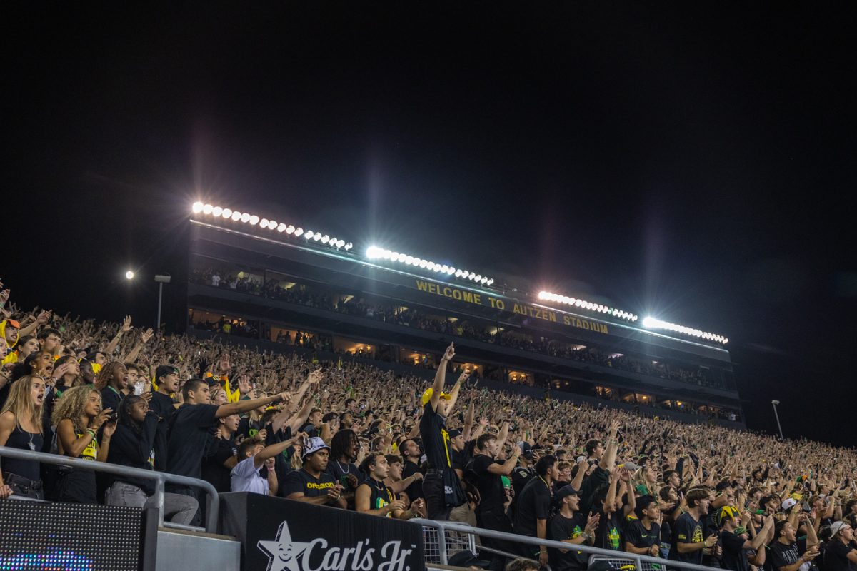 Duck fans celebrate as the clock winds down in the 4th quarter. The number 3 ranked Oregon Ducks football team takes on the number 2 ranked Ohio State University Buckeyes on Oct. 12, 2024, at Autzen Stadium in Eugene, Ore. (Molly McPherson/Emerald)