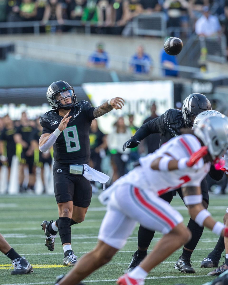 Dillon Gabriel (8) throws the ball down the field. The number 3 ranked Oregon Ducks football team takes on the number 2 ranked Ohio State University Buckeyes on Oct. 12, 2024, at Autzen Stadium in Eugene, Ore. (Molly McPherson/Emerald)