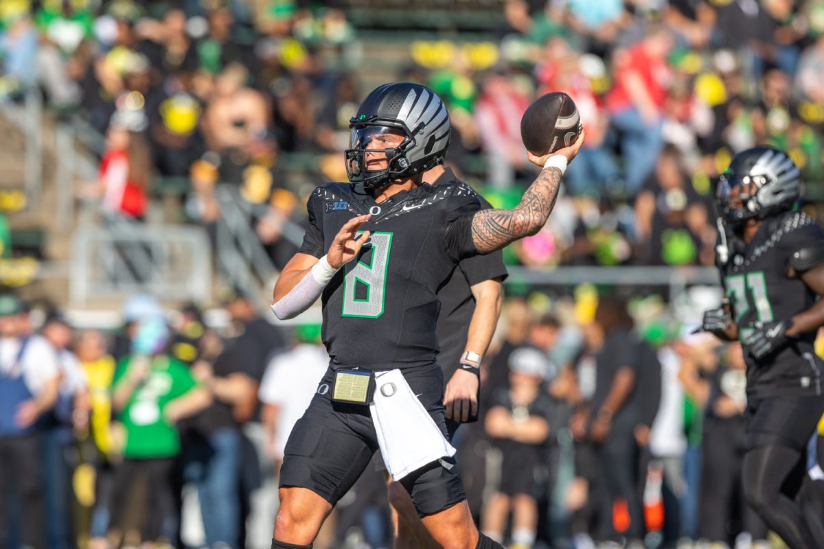 Oregon quarterback Dillon Gabriel (8) warms up before the game. The number 3 ranked Oregon Ducks football team takes on the number 2 ranked Ohio State University Buckeyes on Oct. 12, 2024, at Autzen Stadium in Eugene, Ore. (Molly McPherson/Emerald)