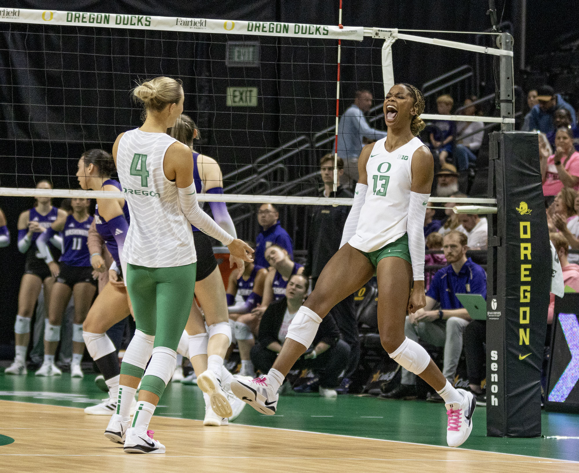 Oregon middle blocker Onye Ofoegbu celebrates after a successful spike. The University of Oregon Ducks fought tooth and nail for a 3-2 win over the University of Washington Huskies Sunday. Now 13-2 in the season, the Ducks next play the University of Wisconsin Badgers Oct. 18. (Miles Cull/Emerald)