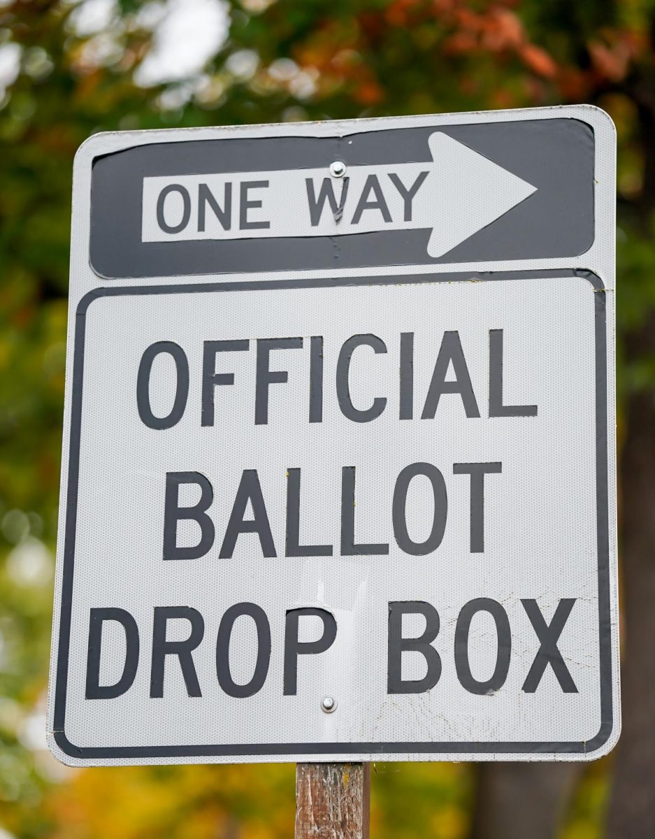 A sign indicating the road where cars can drop off their ballots. 2024 Election Ballot, Eugene Oregon, October 16, 2024 (Eddie Bruning/Emerald)