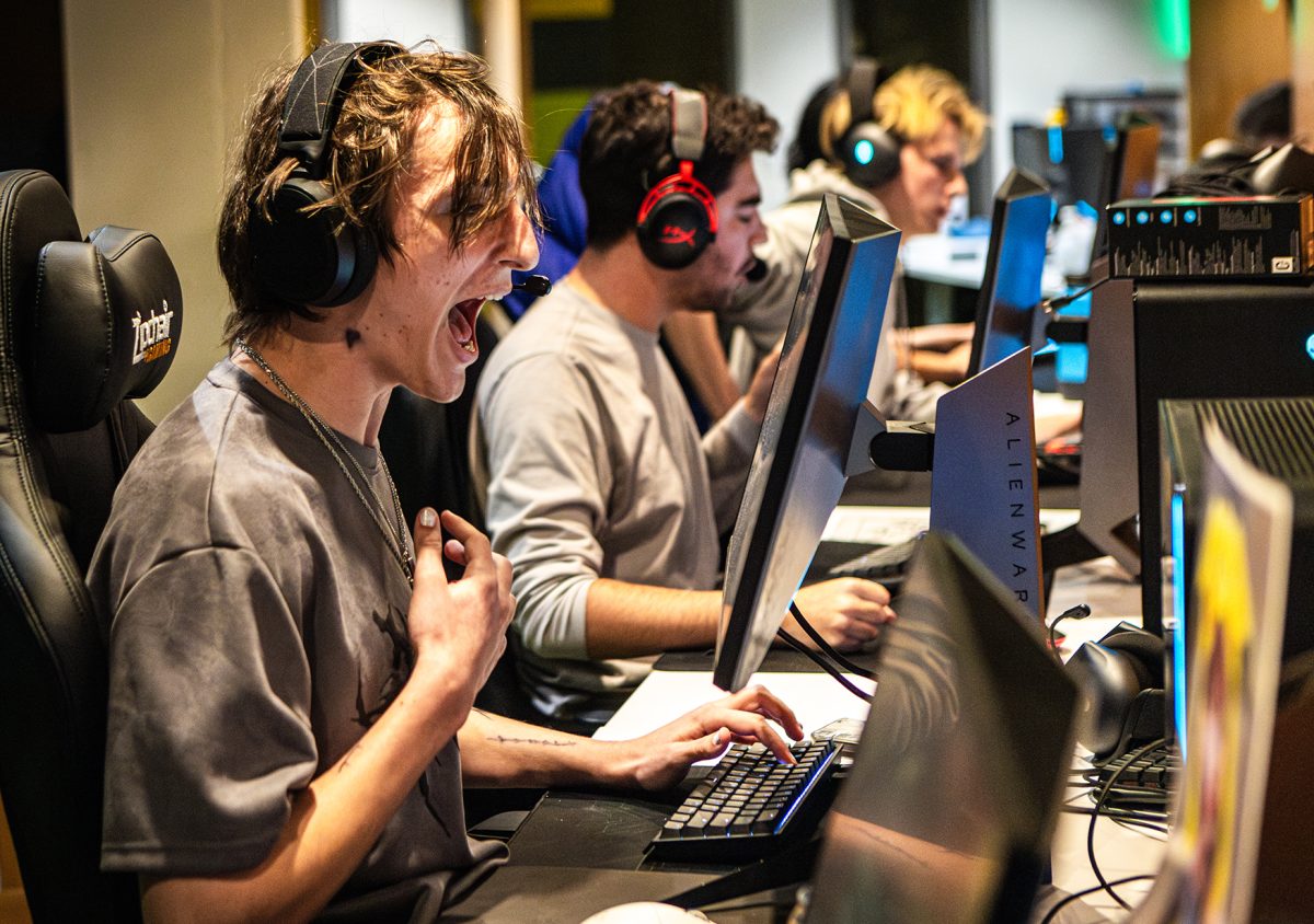 Weston “ryu” Battles from the Valorant Green team reacts passionately during the match, alongside his teammates. UO Green was competing in the Xfinity Run It Back tournament, a three-week event sponsored by Xfinity, while the Yellow/White team participated in the Playfly league. This match took place at the UO Esports Lounge on Tuesday night, Oct. 22, 2024. (Max Unkrich/Emerald)