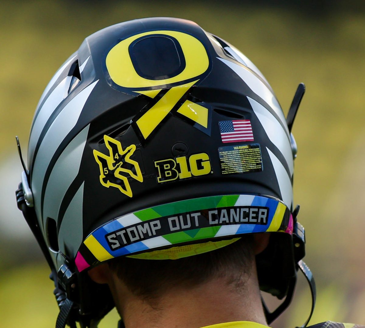 The University of Oregon wearing their “Hero” jersey with custom stickers representing all forms of cancer. University of Oregon takes on Michigan State University at Autzen Stadium, Eugene, October 4th 2024. (Eddie Bruning/Emerald)