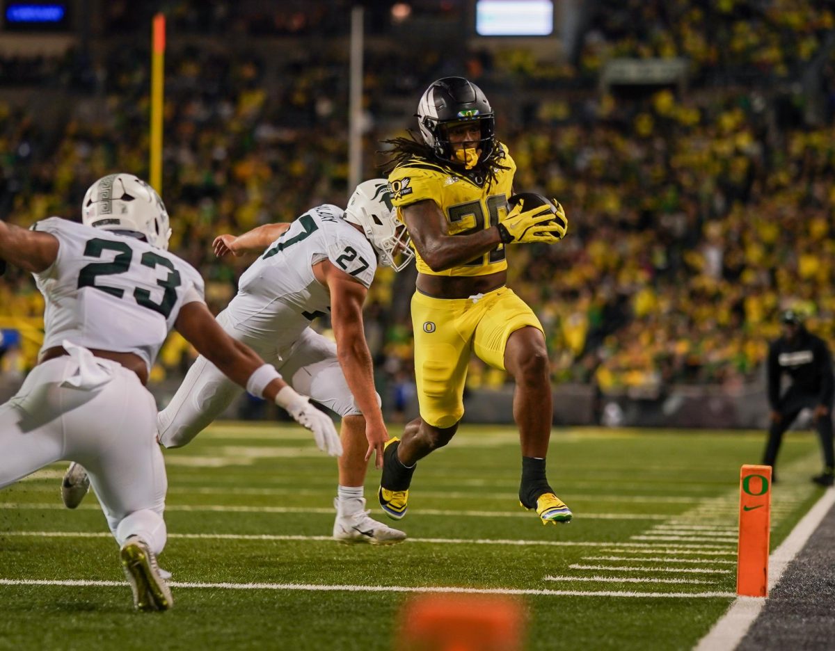 University of Oregon running back, Jordan James (20), out runs the Michigan State defense and scores. University of Oregon takes on Michigan State University at Autzen Stadium, Eugene, October 4th 2024. (Eddie Bruning/Emerald)