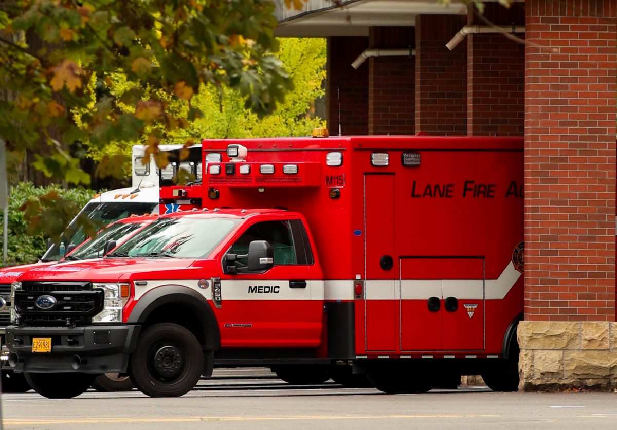 3 Lane County ambulances lined up in the back of Sacred Heart Medical Center located in Springfield. City News: New ER, Springfield, Ore. Oct. 9 2024. (Eddie Bruning/Emerald)