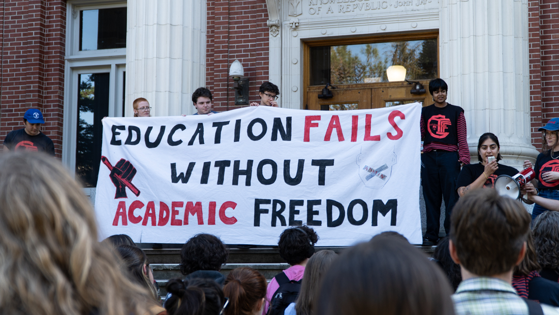 Students with Graduate Teaching Fellows Federation (GTFF) holding a sign for the protest. (Saj Sundaram/Emerald)