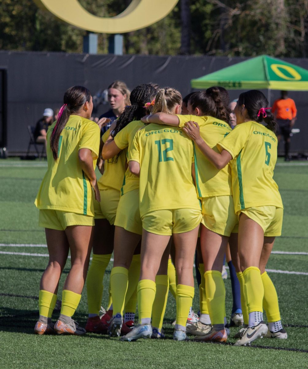 Teammates surround sophomore Grace Mensah (second from left) following her first career goal. Mensah headed the ball past Wolverines goalkeeper Stephanie Sparkowski in the 25th minute of Saturday’s 1-1 Senior Day contest against Michigan.