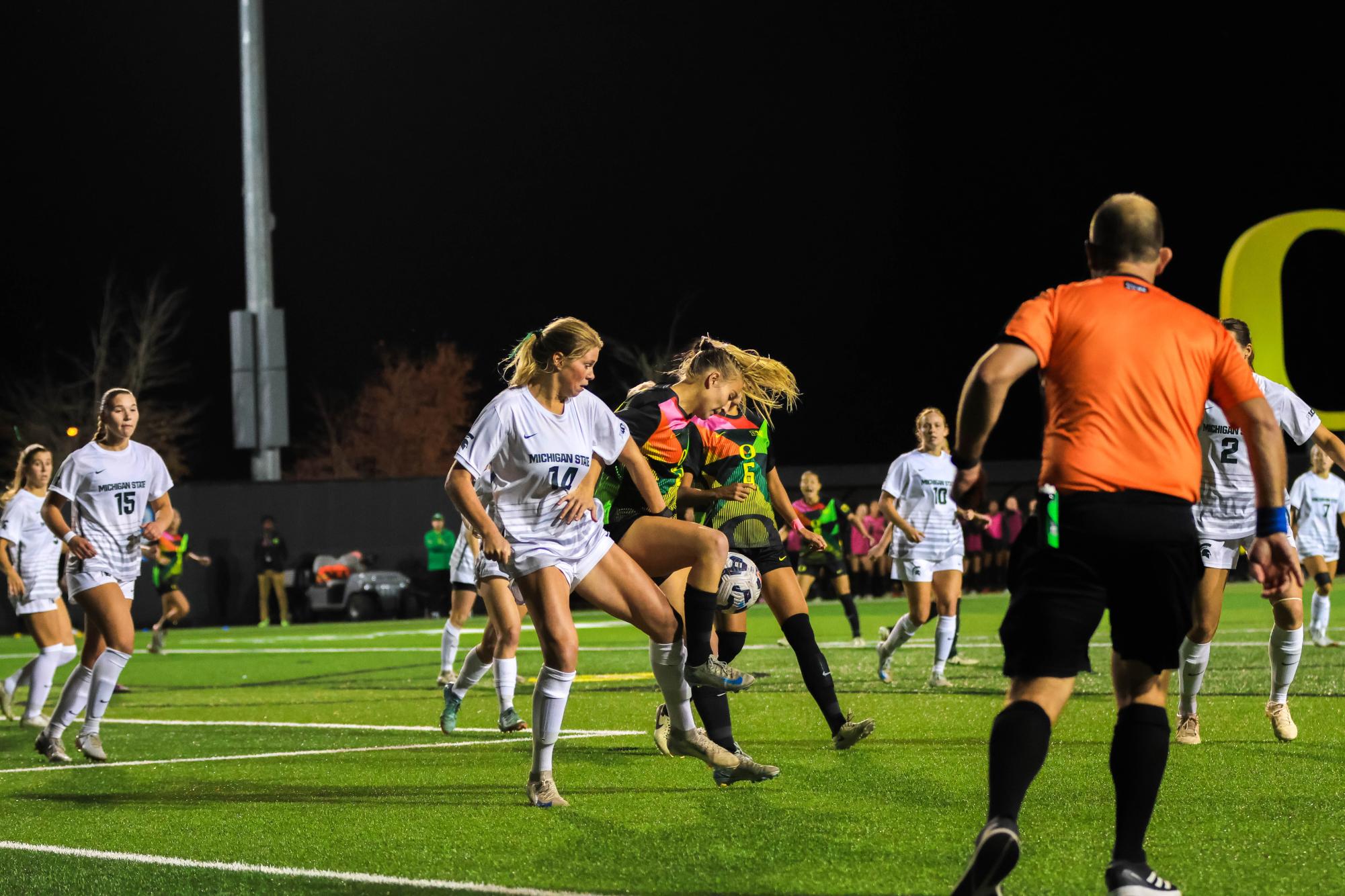 Oregon player fights for possession of the ball.  Oregon Women's Soccer game against Michigan State ends in a draw 0-0 on October 10th, 2024. (JR Quint/Emerald)