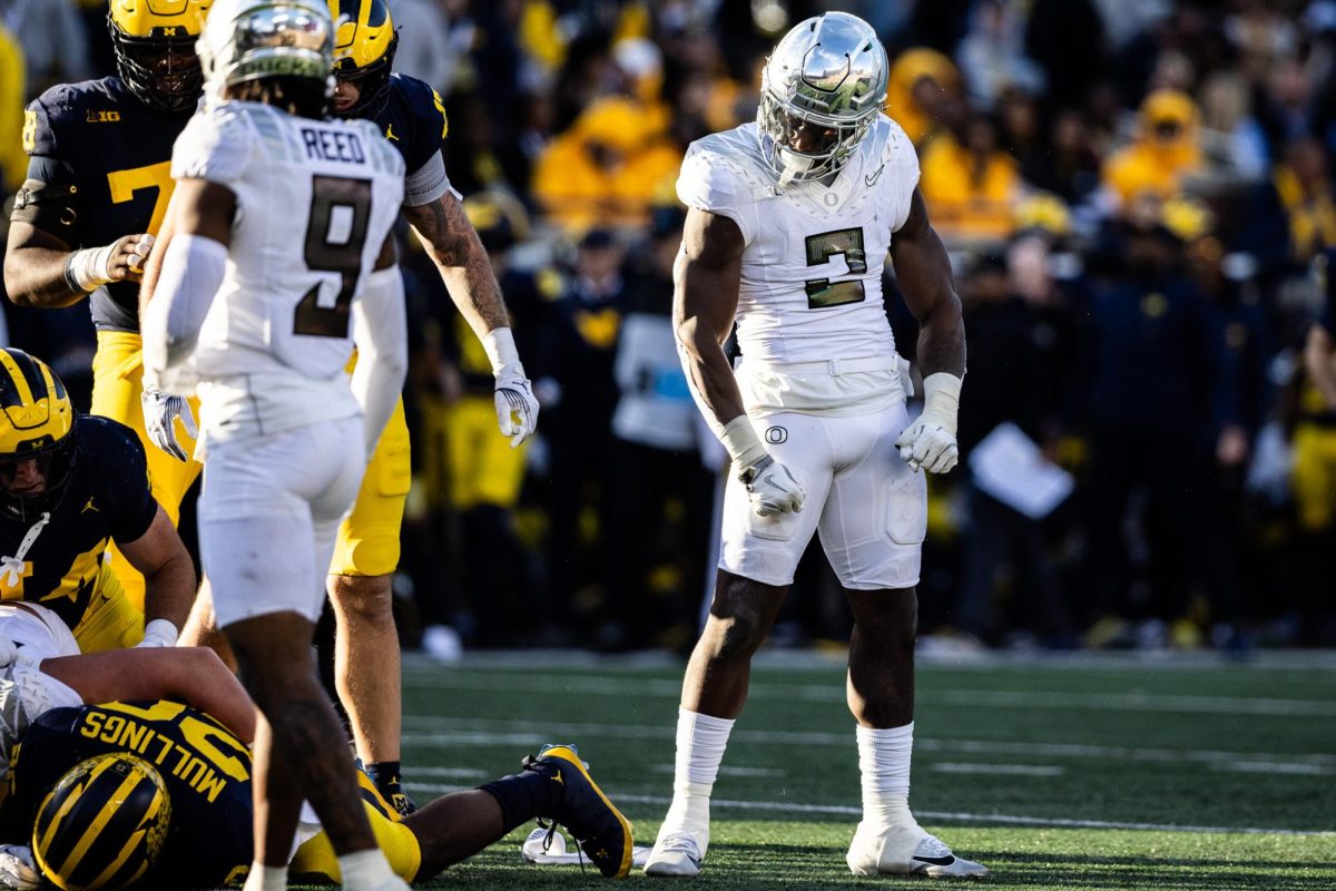 Oregon defensive leader, Jeffrey Bassa (2), celebrates a quick stop in the Michigan backfield to take out any remains of Wolverine momentum on the drive.  The number 1 ranked Oregon Ducks takes on the Michigan Wolverines on Nov. 2, 2024, at the iconic 'Big House" in Ann Arbor, Mich. (Jonathan Suni/Emerald)