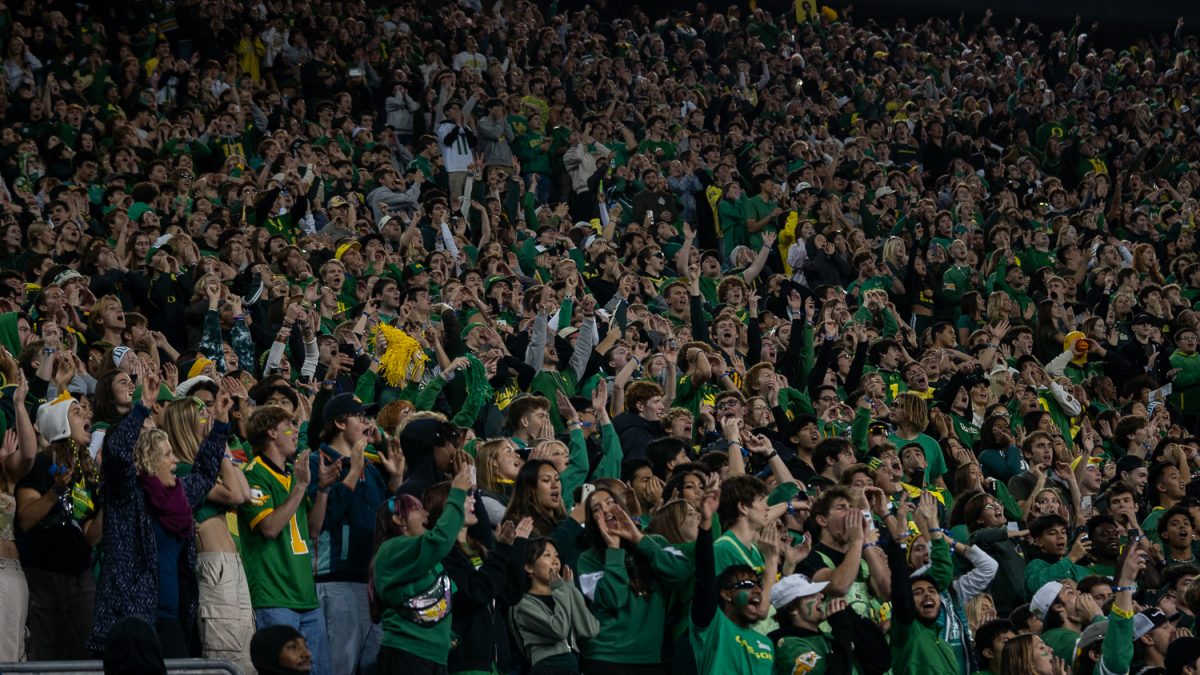 Student clapping and singing during the third quarter ritual Shout. The Oregon Ducks played against the Maryland Terrapins at Autzen Stadium in Eugene, Ore. on Nov. 9. (Saj Sundaram/Emerald)