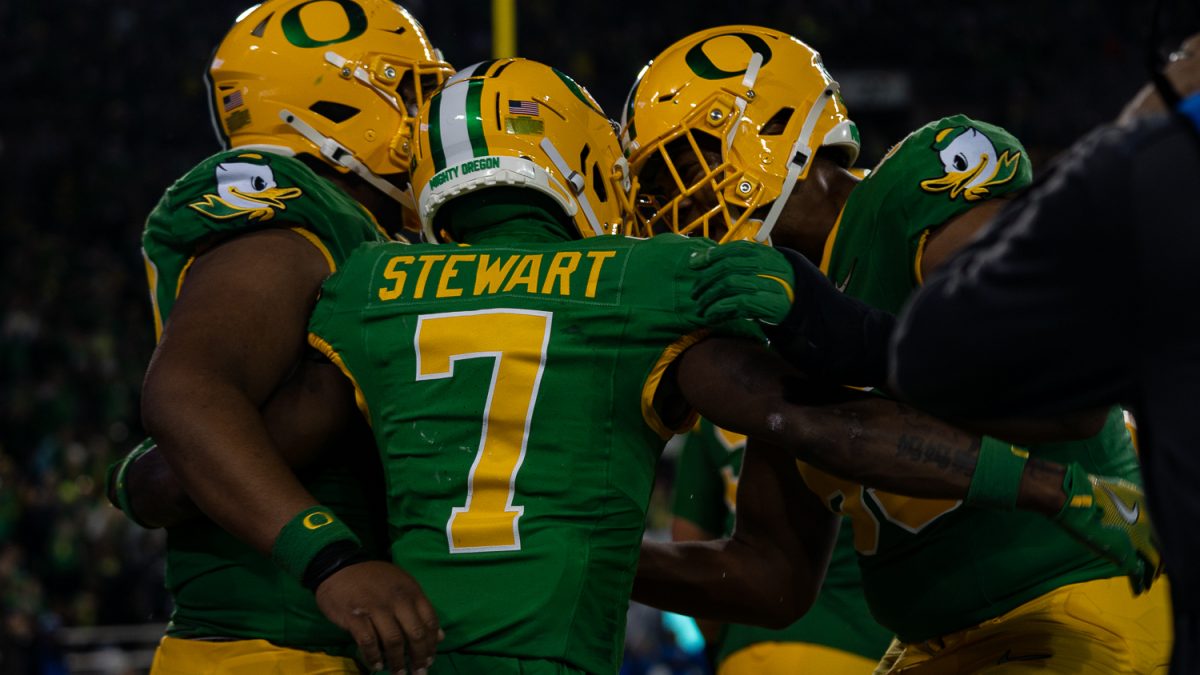 Evan Stewart celebrating with teammates after a succesful touchdown. The Oregon Ducks played against the Maryland Terrapins at Autzen Stadium in Eugene, Ore. on Nov. 9. (Saj Sundaram/Emerald)