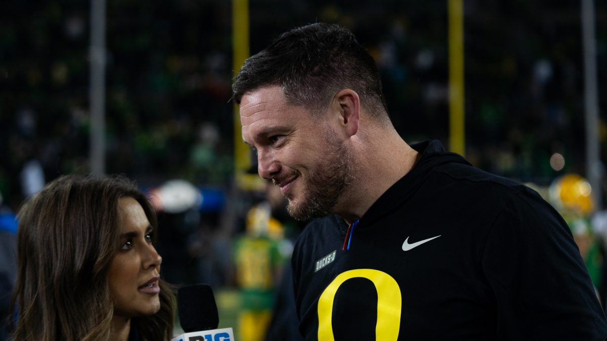 Head coach Dan Lanning talks to a reporter from the B1G Ten Network after the game. The Oregon Ducks played against the Maryland Terrapins at Autzen Stadium in Eugene, Ore. on Nov. 9. (Saj Sundaram/Emerald)