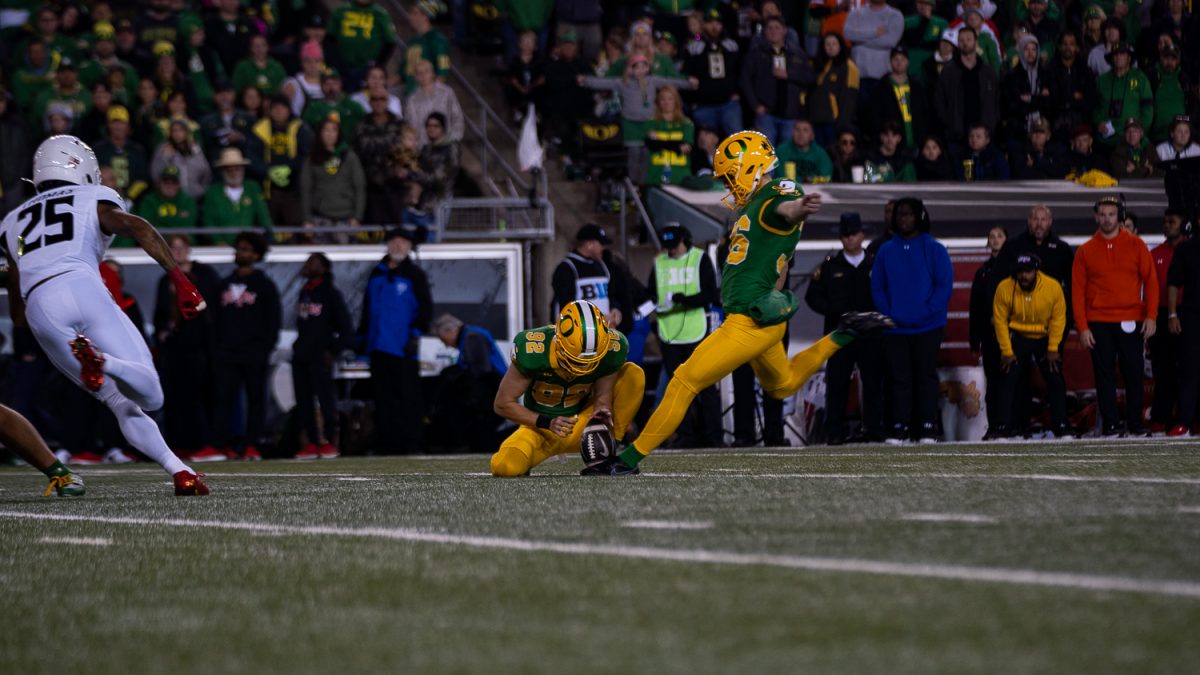 Atticus Sappington, kicker for the Ducks, kicking a field goal. The Oregon Ducks played against the Maryland Terrapins at Autzen Stadium in Eugene, Ore. on Nov. 9. (Saj Sundaram/Emerald)