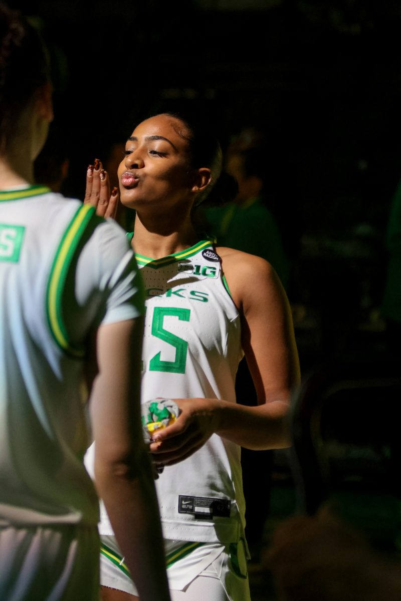 Starting Guard, Deja Kelly (25), poses at the end of the Oregon Ducks line up prior to tip off. The number 25 ranked Oregon Ducks host the North Texas Mean Green at Matthew Knight Arena in Eugene, Ore., on Nov. 12, 2024. (Julia Massa/Emerald)