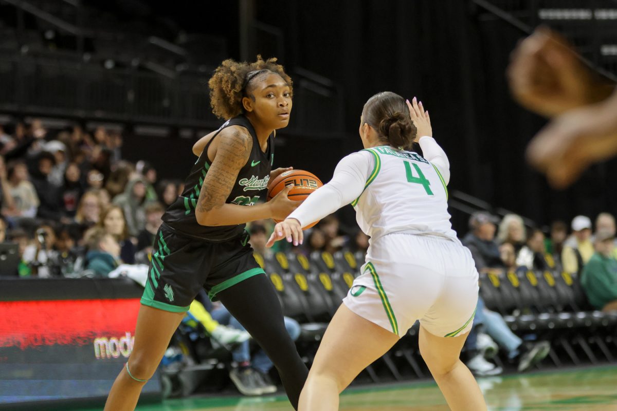 Oregon guard, Nani Falatea (4) defends Shadasia Brackens (23) as she looks to advance toward the net. The number 25 ranked Oregon Ducks host the North Texas Mean Green at Matthew Knight Arena in Eugene, Ore., on Nov. 12, 2024. (Julia Massa/Emerald)