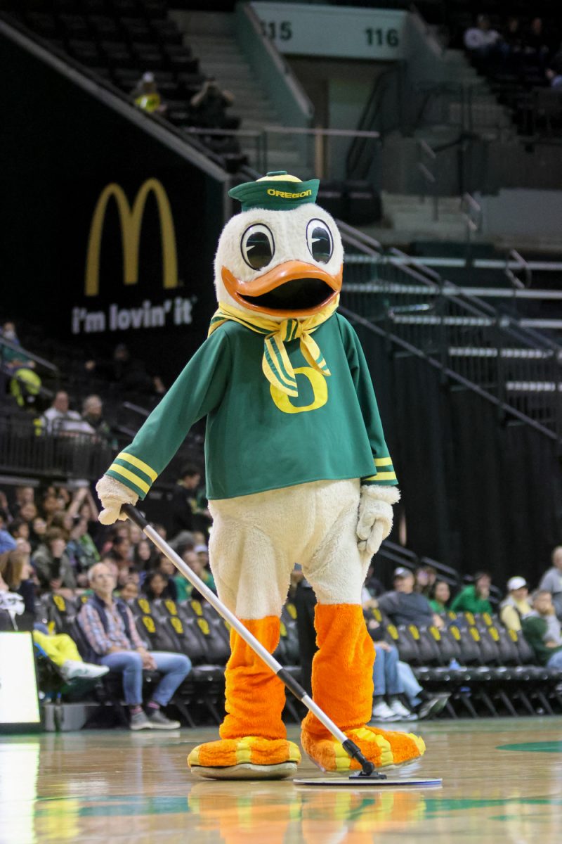 The Oregon Duck takes matters into its own hands and begins mopping the court during a timeout. The number 25 ranked Oregon Ducks host the North Texas Mean Green at Matthew Knight Arena in Eugene, Ore., on Nov. 12, 2024. (Julia Massa/Emerald)