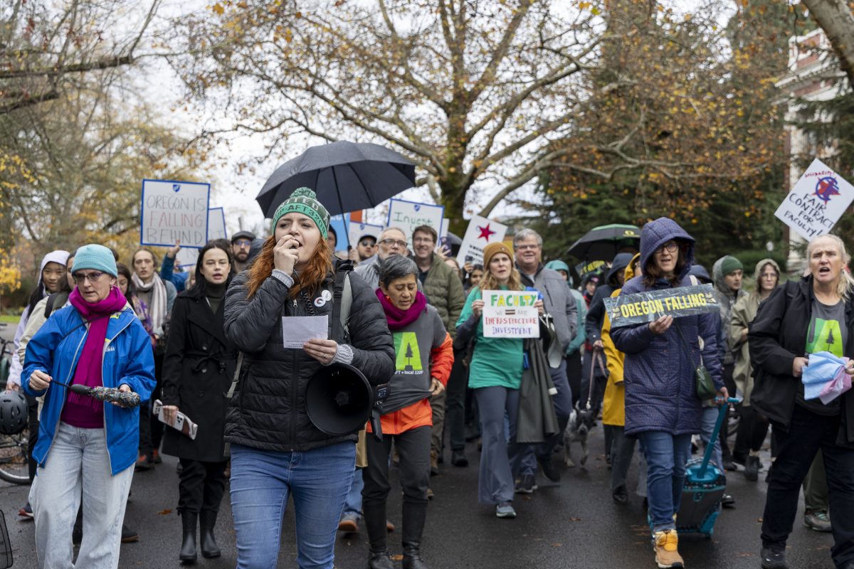 Kaleigh Bronson leads chants during the march after a rally at Johnson Hall in support of the University of Oregon United Academics on Nov. 13, 2024. After the rally, demonstrators marched to Chiles Hall, where UO and UA teams met for a bargaining session. (Alex Hernandez/Emerald)