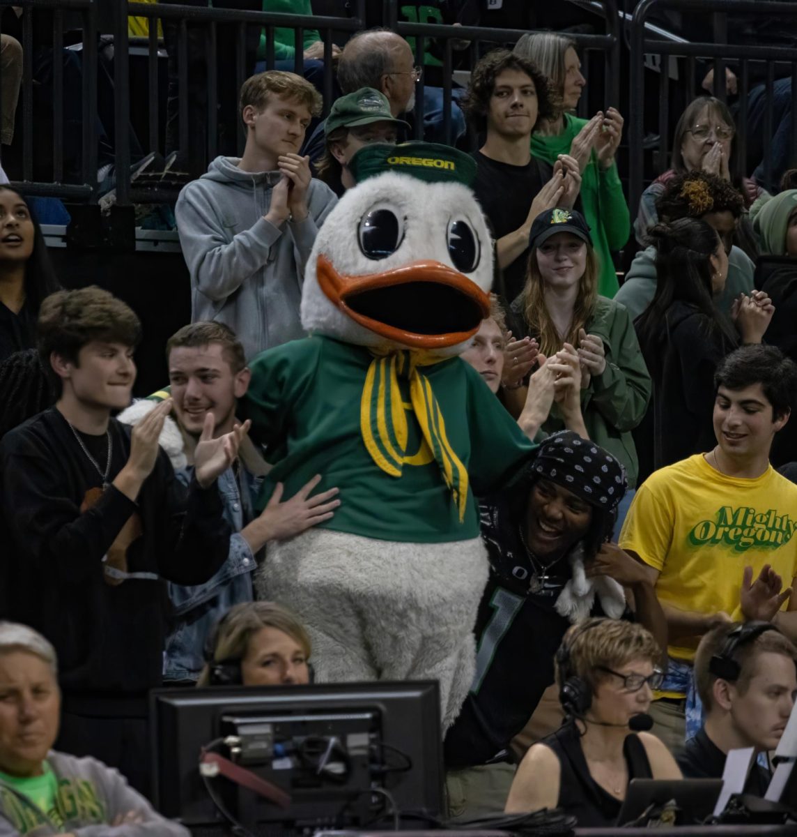 The Oregon Duck stands with fans in the student section during Sunday nights match in Matthew Knight Arena. The Oregon Ducks played against the Baylor Bears. Ducks winning 76-74. 