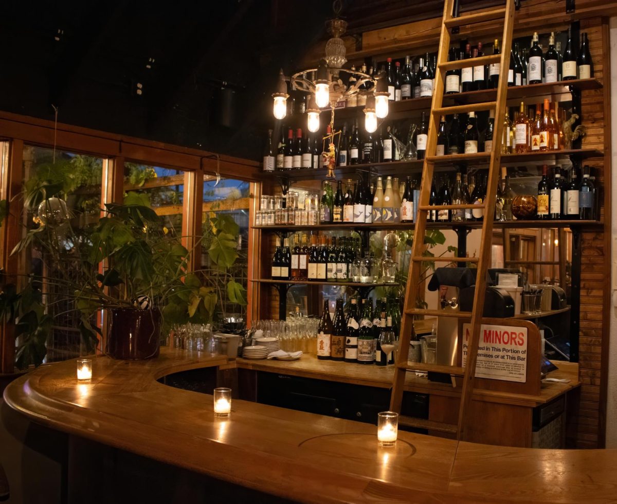 One of two bar areas in Izakaya Meiji. There is a bar seated in the corner, on each respective side of Izakaya Meiji. Izakaya Meiji is a Japanese tavern that also serves small plates of food. Izakaya Meiji is located on 345 Van Bren St. Eugene, Ore. 