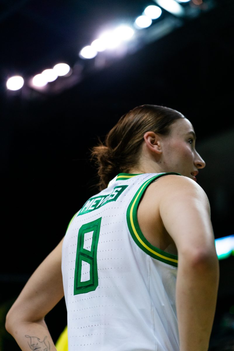 Elisa Mevius (8) under the lights of MKA pre-game. The University of Oregon Ducks Women's Basketball team defeated the University of Nevada Wolf Pack 76-58 in a home game at Matthew Knight Arena in Eugene, Ore., on Nov. 6, 2024. (Rowan Campbell/Emerald).