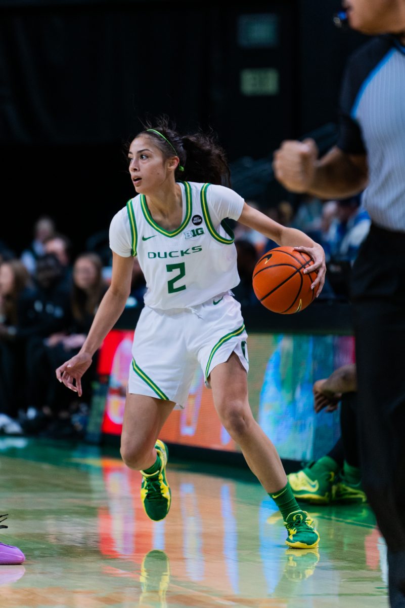 Katie Fiso (2) traveling to the opposing basket midcourt. The University of Oregon Ducks Women's Basketball team defeated the University of Nevada Wolf Pack 76-58 in a home game at Matthew Knight Arena in Eugene, Ore., on Nov. 6, 2024. (Rowan Campbell/Emerald).