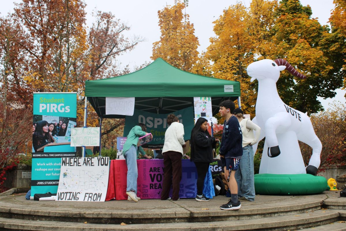 Oregon State Public Interest Research Group tabling in the Erb Memorial Union Amphitheater on Election Day (Daily Emerald/Riley Fox)