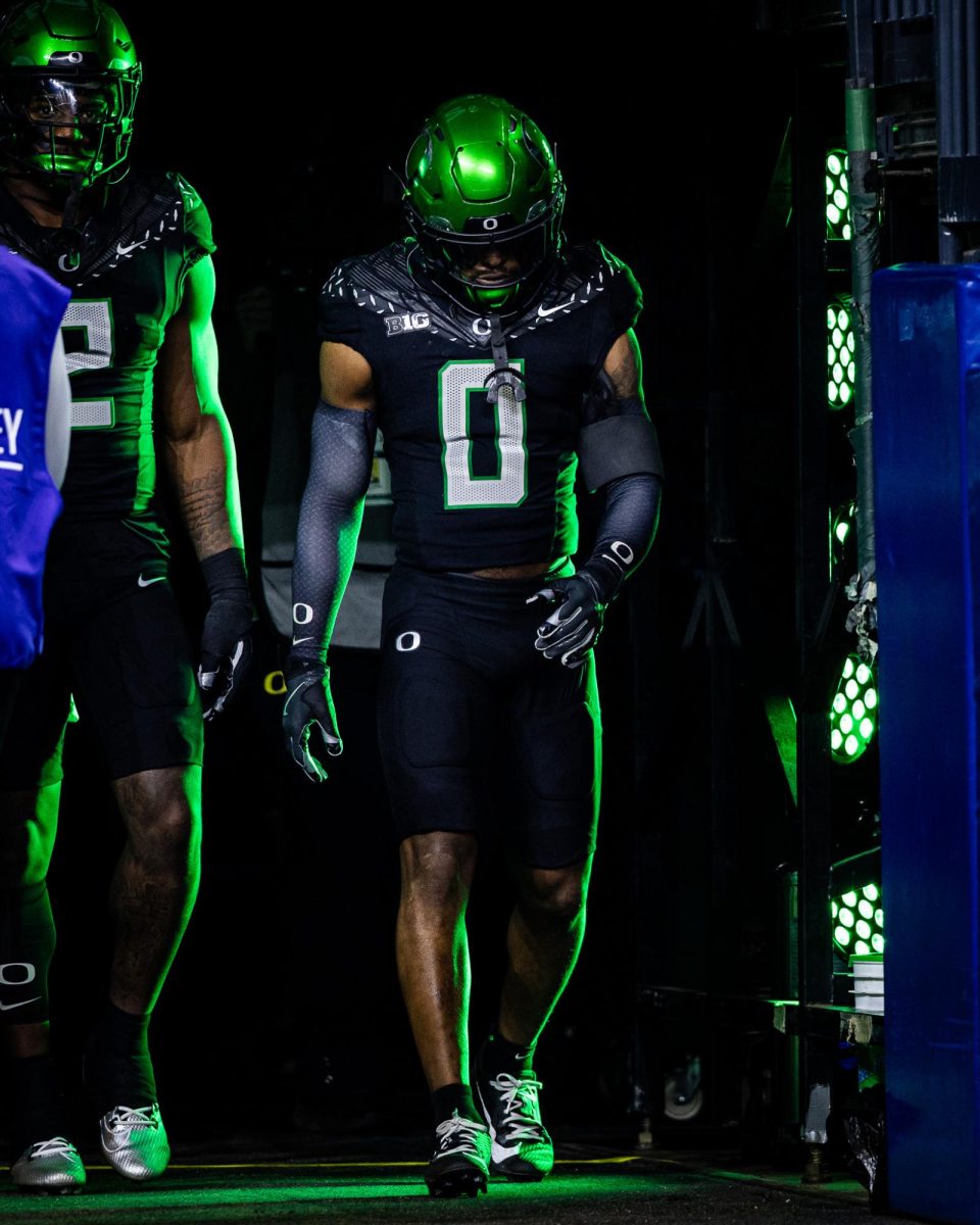 Tysheem Johnson (0) walks out of the tunnel with his fellow captains as they prepare for the coin toss. The number 1 ranked Oregon Ducks take on the number 4 Penn State Nittany Lions on Dec. 7, 2024, at Lucas Oil Stadium in Indianapolis, IN. (Jonathan Suni/Emerald)
