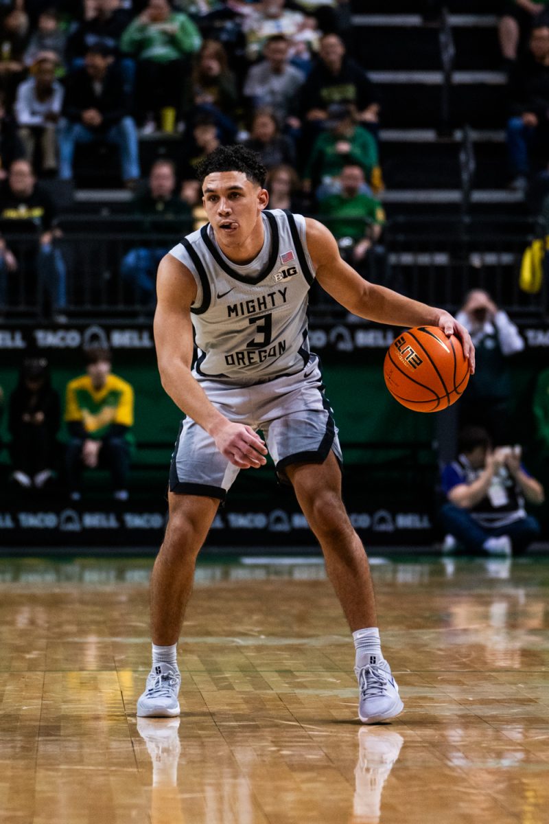 Jackson Shelstad (3) dribbles the ball. The University of Oregon Ducks Mens Basketball team defeat the SFA Lumberjacks (79-61) in a home match at Matthew Knight Arena in Eugene, Ore., on Dec. 15, 2024. (Rowan Campbell/Emerald).