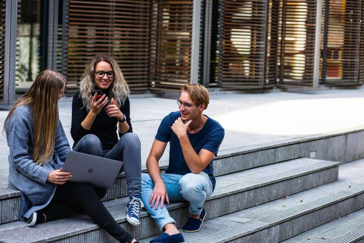 https://www.pexels.com/photo/three-persons-sitting-on-the-stairs-talking-with-each-other-1438072/