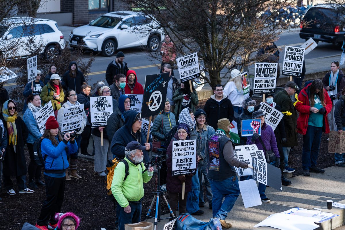 Protestors convine at the Wayne L. Morse U.S. Courthouse to be at the 