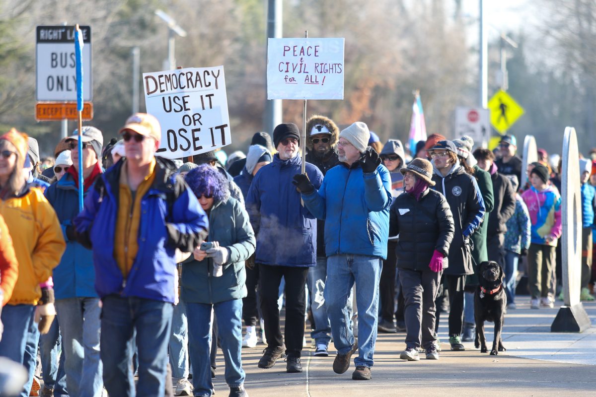 MLK Day Marchers walk towards Alton Baker Park in Eugene, Ore. on Jan 20, 2025 (Tyler Graham/Emerald)