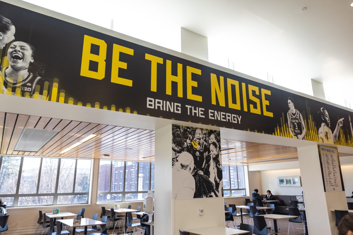 A mural depicting images of the Oregon women's and men's basketball teams and their schedules is on display in the Erb Memorial Union. The mural was designed and produced by the Allen Hall Adveritsing team. (Molly McPherson/Emerald)