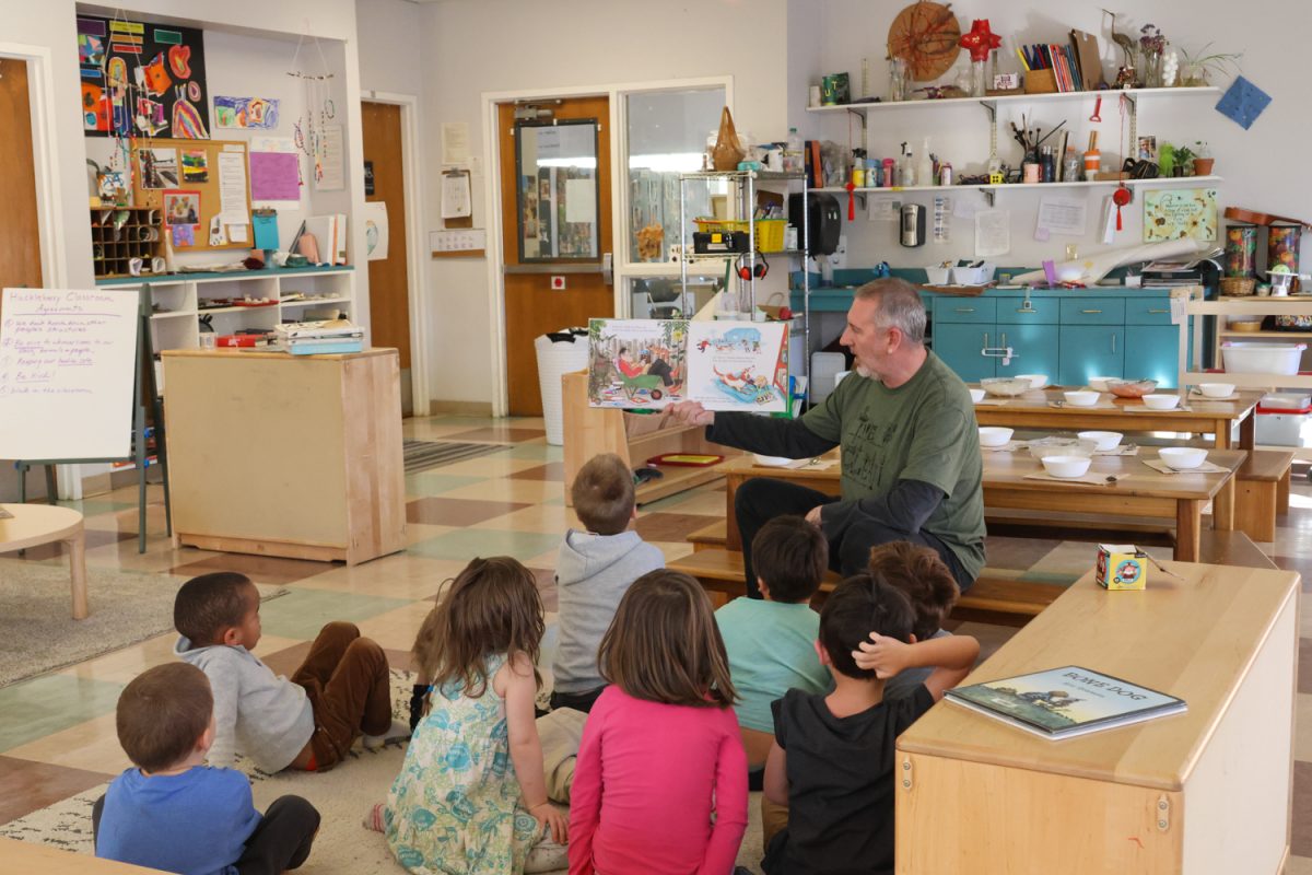 Eric Sutton, PreK/K Lead Teacher, begins reading a story to his class prior to snack time. (Julia Massa/Emerald)