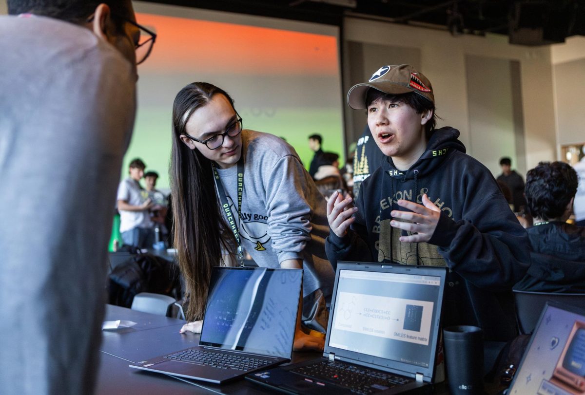 Keagan Koski, Maddy Santoso, and Kat Lai, part of Team Braces, developed a tool for simulating the bond and reconstruction of atomic chemical entities. Students take part in the final day of QuackHacks, the University of Oregon’s 24-hour hackathon, on Jan. 19, 2025, a student-led event bringing together innovative participants for coding, learning, and building. (Max Unkrich / Emerald)