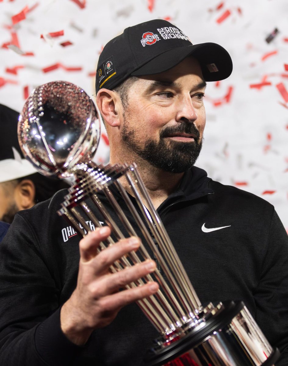 Ohio State Head Coach Ryan Day holds the Leishman Trophy proudly after winning the Rose Bowl. The University of Oregon Ducks Football team played the Ohio State University Buckeyes in the Rose Bowl at Rose Bowl Stadium in Pasadena, Calif., on Jan. 1, 2025, where they lost 41-21. (Max Unkrich/Emerald)