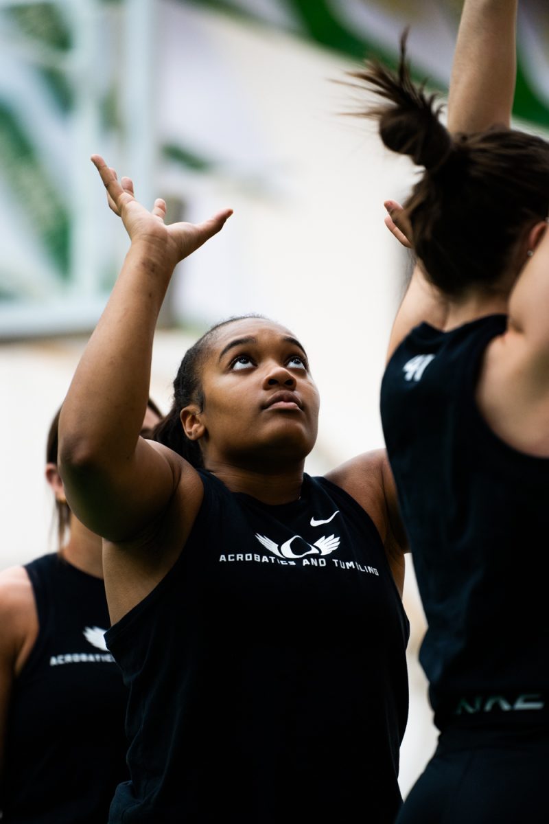 Blessyn Mcmorris (22) practicing her routine. The University of Oregon Ducks Acrobatics and Tumbling team practices at Matthew Knight Arena in Eugene, Ore., on Feb. 6, 2025. (Rowan Campbell/Emerald).