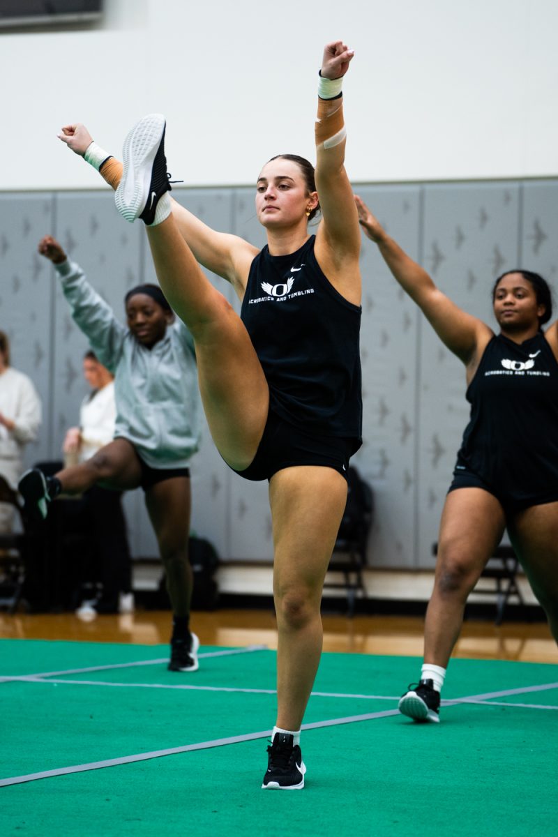 Bella Swarthout (10) during warm ups. The University of Oregon Ducks Acrobatics and Tumbling team practices at Matthew Knight Arena in Eugene, Ore., on Feb. 6, 2025. (Rowan Campbell/Emerald).