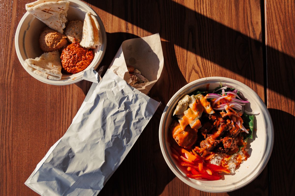 Atlas Mediterranean is one of the two new additions of businesses arriving on East 13th Ave in Eugene Oregon. Specializing in mediterranean cuisine, they sell wraps, salads and sandwiches. Pictured are three of their best sellers; the Harissa Steak Bowl, Classic Chicken Gyro, and Hummus Trio & House Made Pita Bread (Eduardo Garcia/Emerald)