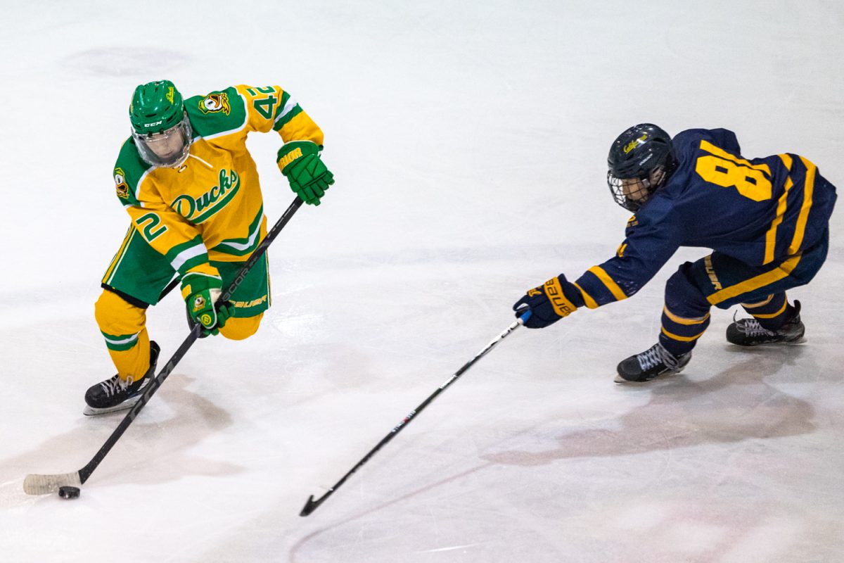 Carson Streich (41) maneuvers the puck around Patrick Liu (81). The Oregon Ducks men’s hockey team faced off against the University of California Golden Bears on Feb. 2, 2025 at the Rink Exchange in Eugene, Ore. (Molly McPherson/Emerald)