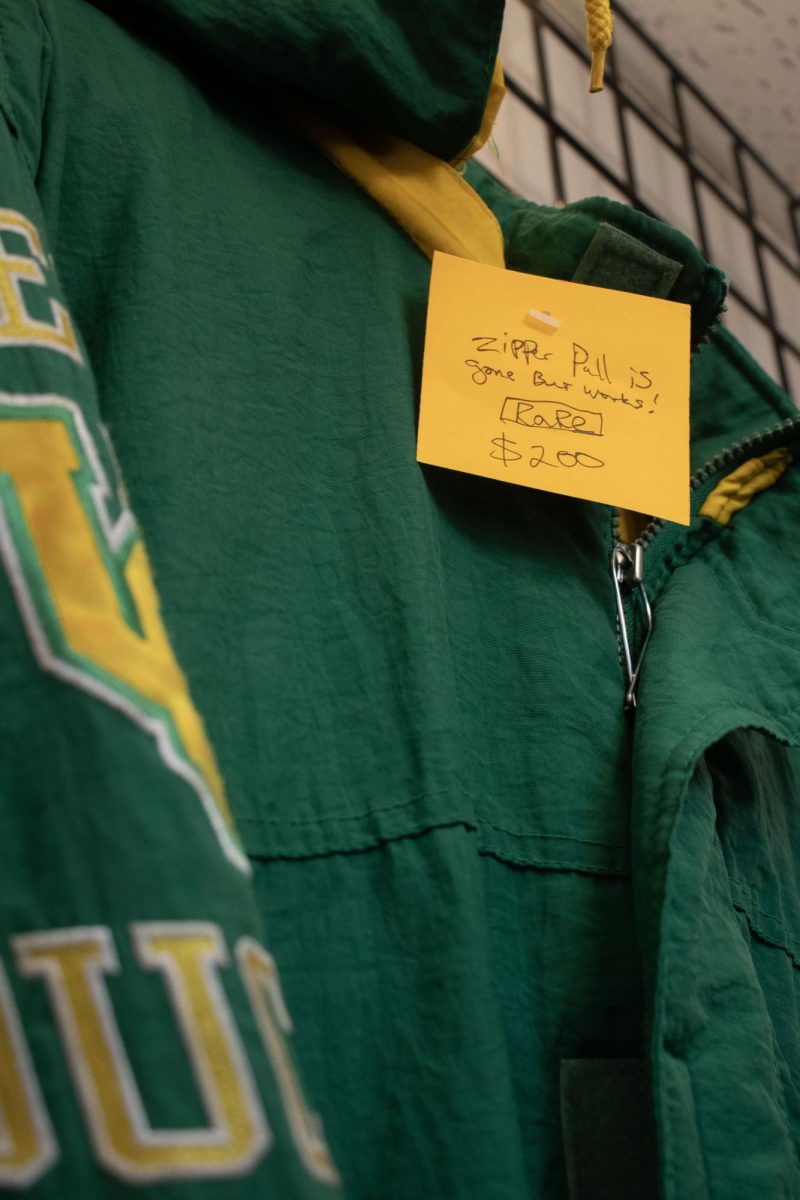 Jacket on display at a thrift store, the price tag is marked as rare with a missing zipper and priced for $200. (Alyssa Garcia/Emerald)  
