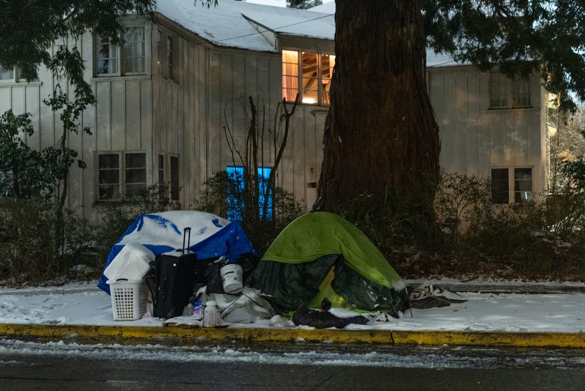 Tents rest covered in snow in Eugene. (Miles Cull/Emerald)