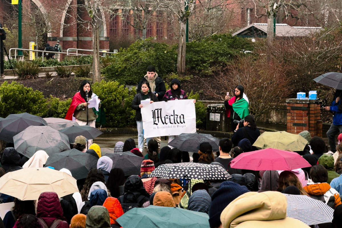 Student led group Mecha address crowd gathered in front of the Erb Memorial Union on the campus of the University of Oregon. Feb. 19, 2025, in Eugene, Ore. (Eduardo Garcia/Emerald)