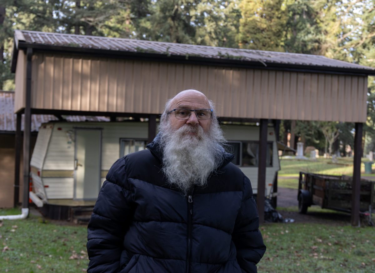 George Dull in front of his trailer home in the Eugene Pioneer Cemetery located in Eugene, Ore. Dull is the groundskeeper at the cemetery. 