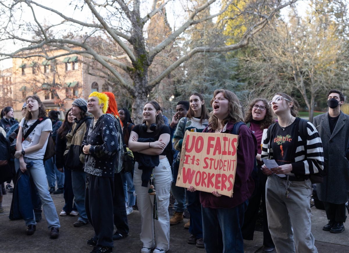 Members of the University of Oregon Student Workers Union and supporters gather to protest the recent contract offer from the University of Oregon. Some of the UO Student Workers’ grievances include a lack of nondiscrimination protections and an offer that included resident assistants having to pay part of their room costs. (Miles Cull/Emerald)